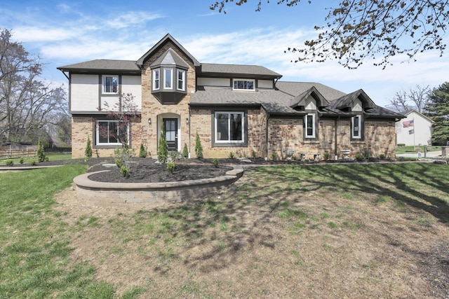5200 Colt Ct, Westerville, OH 43081 - view of front facade with brick siding, a front yard, and roof with shingles