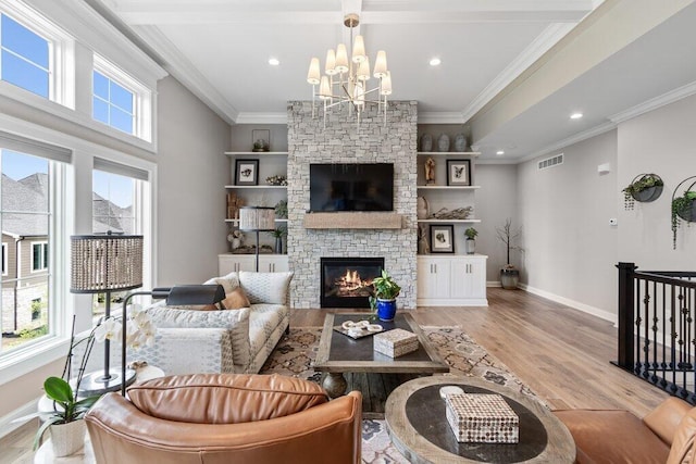 1372 Dogwood Loop, Powell, OH 43065 - living area featuring a fireplace, wood finished floors, a chandelier, ornamental molding, and recessed lighting