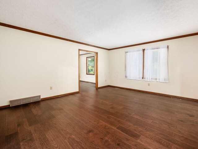 2247 Sonnington Dr, Dublin, OH 43016 - unfurnished room featuring dark wood-type flooring, ornamental molding, and a textured ceiling