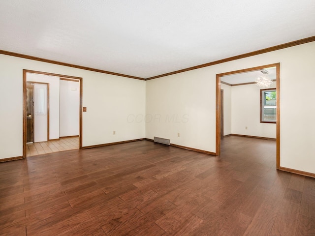 2247 Sonnington Dr, Dublin, OH 43016 - empty room featuring dark wood-style floors and crown molding