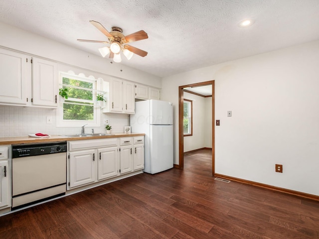 2247 Sonnington Dr, Dublin, OH 43016 - kitchen featuring white appliances, dark wood-style flooring, ceiling fan, white cabinetry, and a textured ceiling
