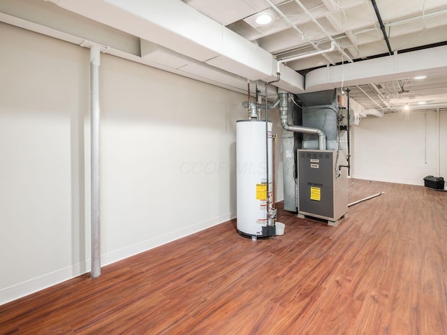 2247 Sonnington Dr, Dublin, OH 43016 - finished basement featuring gas water heater, wood finished floors, and heating unit