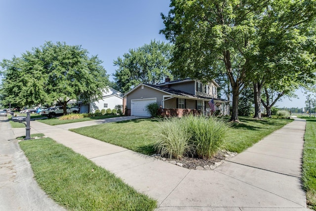 691 Heritage Blvd, Delaware, OH 43015 - view of front of house with concrete driveway, a front lawn, and an attached garage