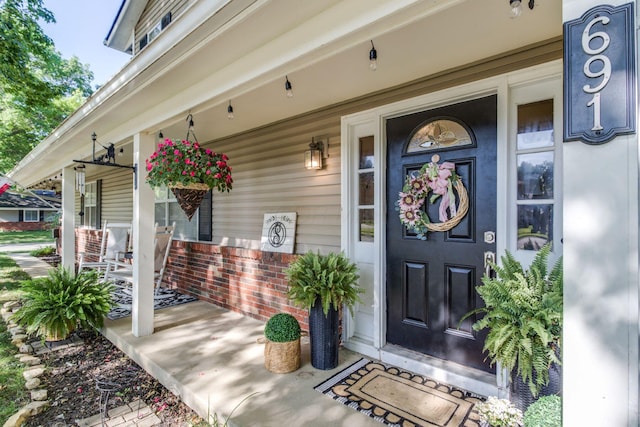 691 Heritage Blvd, Delaware, OH 43015 - doorway to property featuring a porch and brick siding