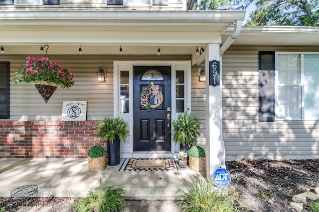 691 Heritage Blvd, Delaware, OH 43015 - entrance to property featuring covered porch and brick siding