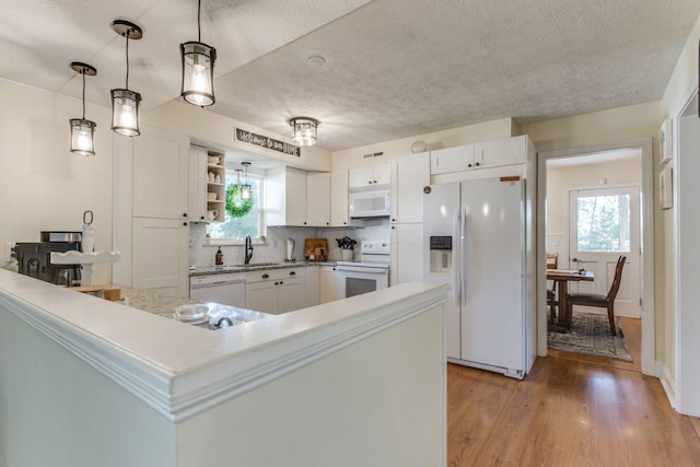 691 Heritage Blvd, Delaware, OH 43015 - kitchen with white appliances, white cabinets, light countertops, open shelves, and a textured ceiling
