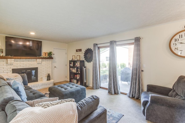 691 Heritage Blvd, Delaware, OH 43015 - carpeted living room featuring a textured ceiling and a brick fireplace