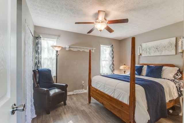 691 Heritage Blvd, Delaware, OH 43015 - bedroom with wood finished floors, a textured ceiling, and ceiling fan