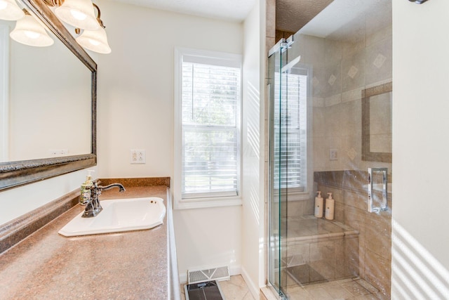 691 Heritage Blvd, Delaware, OH 43015 - full bath featuring vanity, plenty of natural light, a shower stall, and tile patterned floors