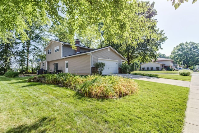 691 Heritage Blvd, Delaware, OH 43015 - view of side of property with driveway, a chimney, a lawn, and a garage