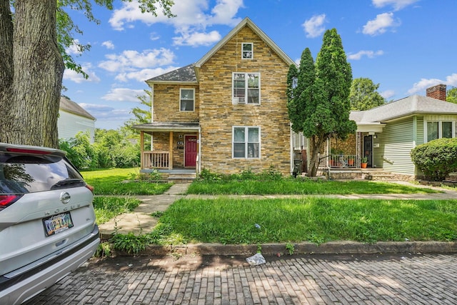 137 Wisconsin Ave, Columbus, OH 43222 - traditional-style home featuring covered porch and stone siding