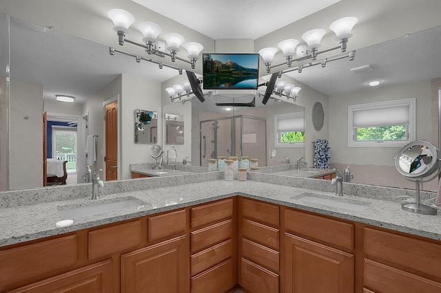 15 Doe St, Plain City, OH 43064 - bathroom with a shower stall, double vanity, and healthy amount of natural light