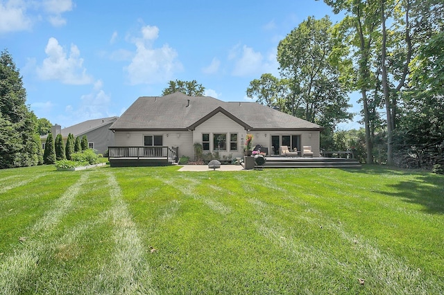 15 Doe St, Plain City, OH 43064 - back of property featuring a deck, a patio area, and a lawn