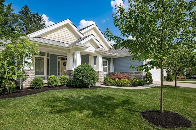 174 Grand Ridge Ct, Gahanna, OH 43230 - craftsman inspired home featuring stone siding, concrete driveway, a front lawn, and a garage