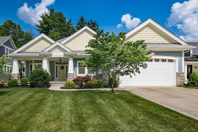 174 Grand Ridge Ct, Gahanna, OH 43230 - craftsman-style house with stone siding, a front lawn, concrete driveway, and board and batten siding