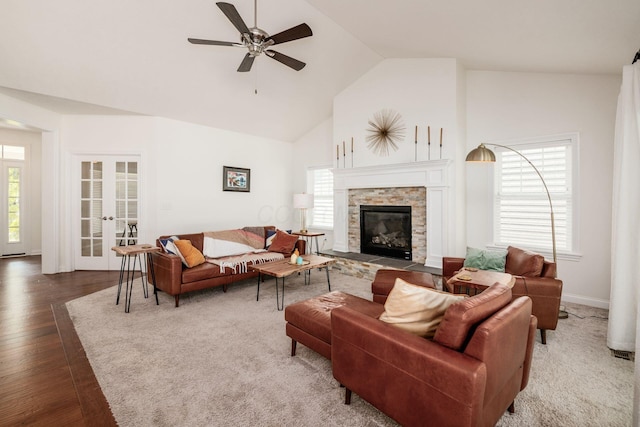 174 Grand Ridge Ct, Gahanna, OH 43230 - living room with a ceiling fan, high vaulted ceiling, wood finished floors, a stone fireplace, and french doors