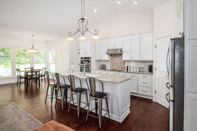 174 Grand Ridge Ct, Gahanna, OH 43230 - kitchen featuring stainless steel appliances, tasteful backsplash, dark wood-type flooring, white cabinetry, and high vaulted ceiling