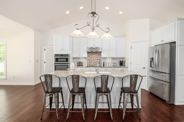 174 Grand Ridge Ct, Gahanna, OH 43230 - kitchen with stainless steel appliances, under cabinet range hood, decorative backsplash, lofted ceiling, and white cabinets