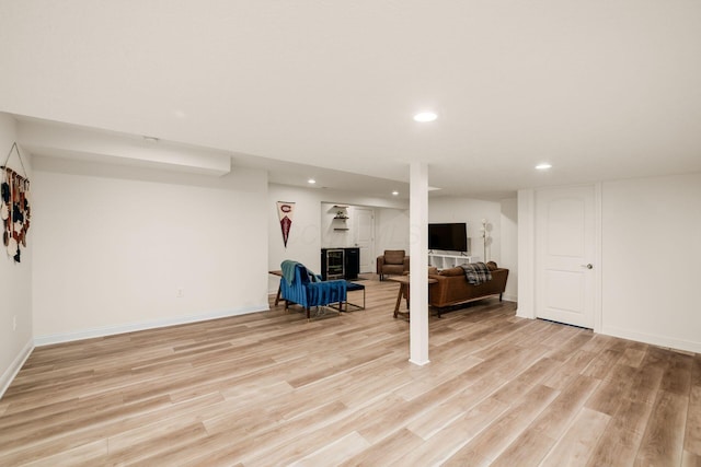 174 Grand Ridge Ct, Gahanna, OH 43230 - finished basement featuring light wood-style floors, recessed lighting, and a fireplace