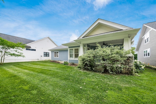 174 Grand Ridge Ct, Gahanna, OH 43230 - rear view of house featuring a ceiling fan and a lawn