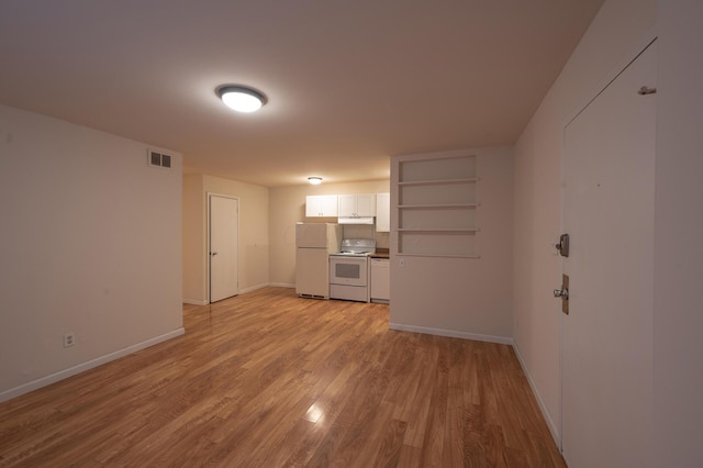 433 E 13th Ave, Columbus, OH 43201 - unfurnished living room with light wood finished floors and baseboards