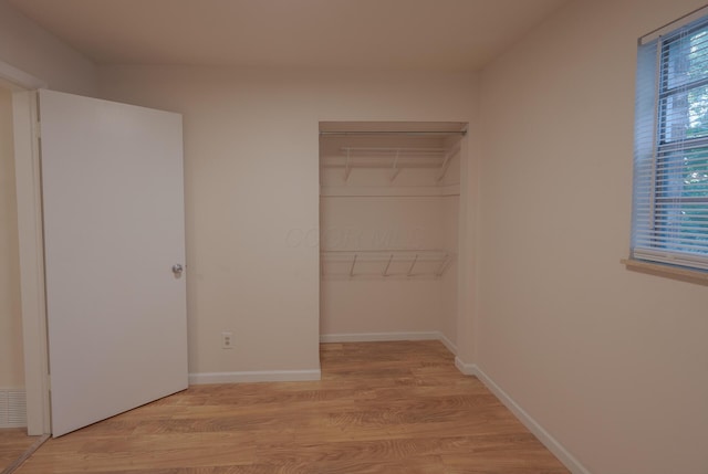 433 E 13th Ave, Columbus, OH 43201 - unfurnished bedroom with a closet and light wood finished floors