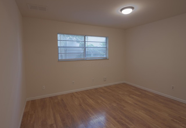 433 E 13th Ave, Columbus, OH 43201 - spare room with wood finished floors and baseboards