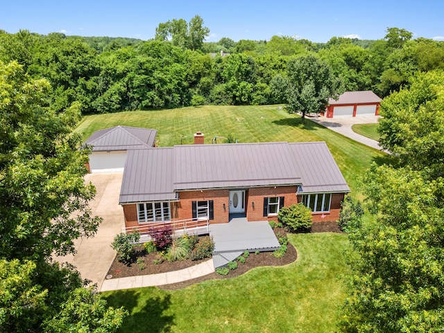 1550 Hiner Rd, Orient, OH 43146 - view of front of property with brick siding, a standing seam roof, an outdoor structure, a metal roof, and a chimney