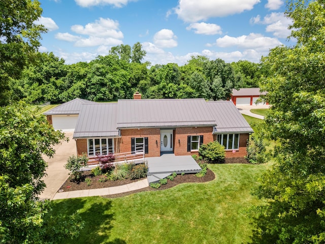 1550 Hiner Rd, Orient, OH 43146 - view of front of home featuring a standing seam roof, brick siding, a chimney, and a metal roof