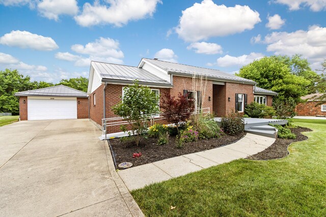 1550 Hiner Rd, Orient, OH 43146 - single story home featuring brick siding, a standing seam roof, a garage, an outdoor structure, and a metal roof