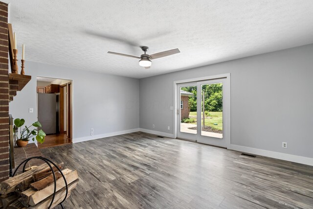 1550 Hiner Rd, Orient, OH 43146 - unfurnished living room with wood finished floors, ceiling fan, and a textured ceiling