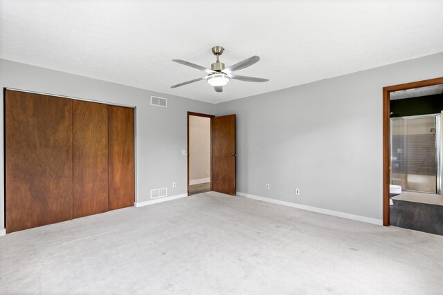 1550 Hiner Rd, Orient, OH 43146 - unfurnished bedroom featuring light colored carpet, a closet, a ceiling fan, and ensuite bathroom