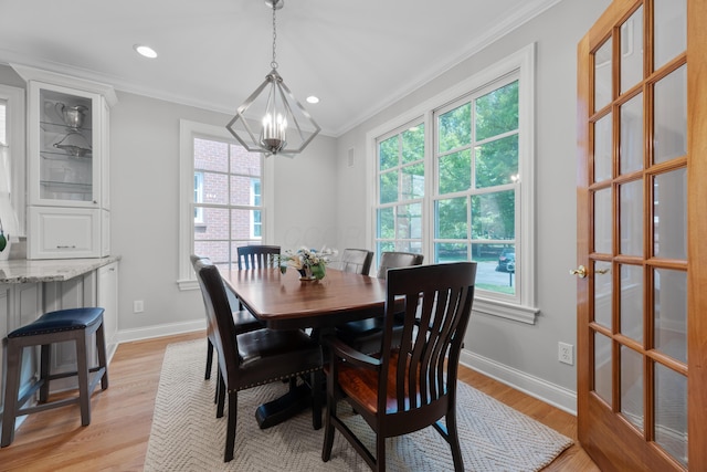 1359 White Oak Ln, New Albany, OH 43054 - dining room featuring ornamental molding, a chandelier, healthy amount of natural light, light wood-type flooring, and recessed lighting