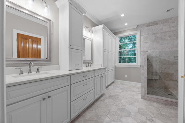 1359 White Oak Ln, New Albany, OH 43054 - bathroom with double vanity, ornamental molding, tiled shower, and recessed lighting