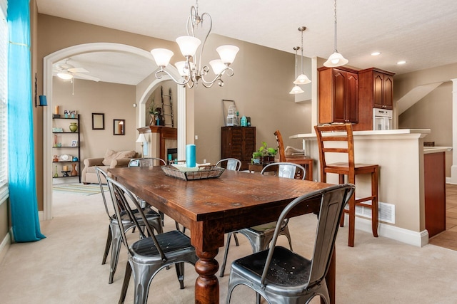 993 Starlight Ln, Westerville, OH 43082 - dining area featuring a ceiling fan, light carpet, arched walkways, a chandelier, and recessed lighting