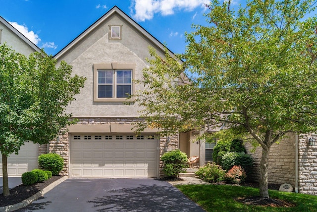 993 Starlight Ln, Westerville, OH 43082 - view of front of property with stucco siding, driveway, and stone siding