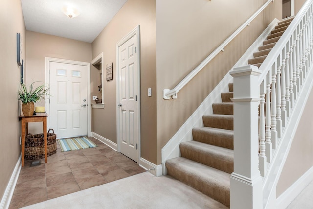 993 Starlight Ln, Westerville, OH 43082 - foyer featuring baseboards and stairway