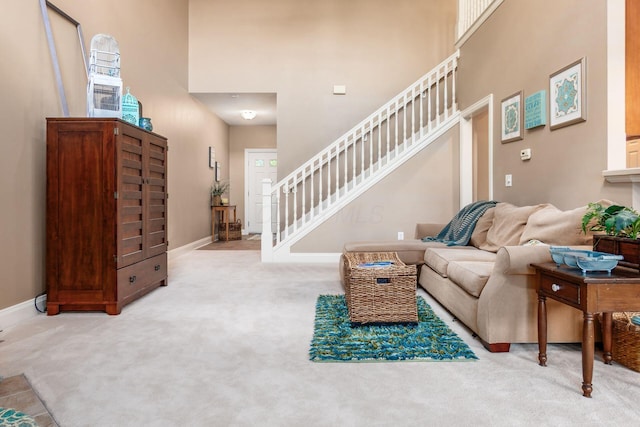 993 Starlight Ln, Westerville, OH 43082 - carpeted living room featuring stairs and a high ceiling