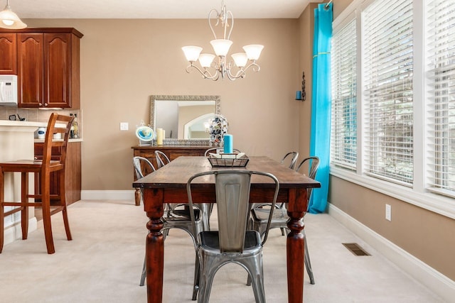 993 Starlight Ln, Westerville, OH 43082 - dining room featuring light colored carpet and a chandelier