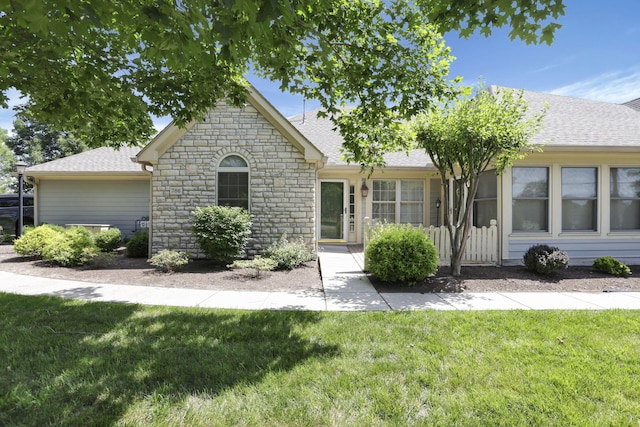 786 Stone Ridge Way, Newark, OH 43055 - view of front of home featuring stone siding, a shingled roof, and a front yard