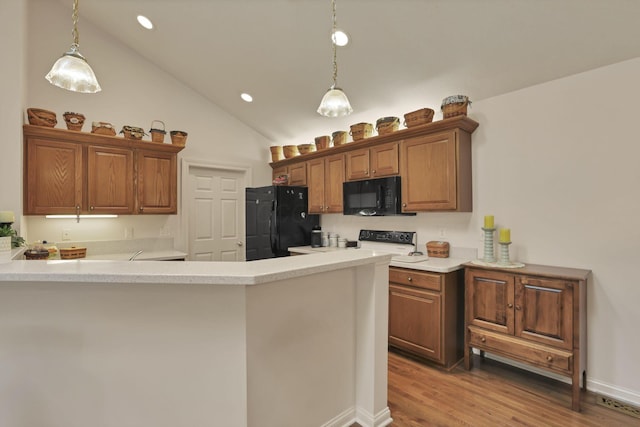 786 Stone Ridge Way, Newark, OH 43055 - kitchen with black appliances, decorative light fixtures, a peninsula, light countertops, and recessed lighting