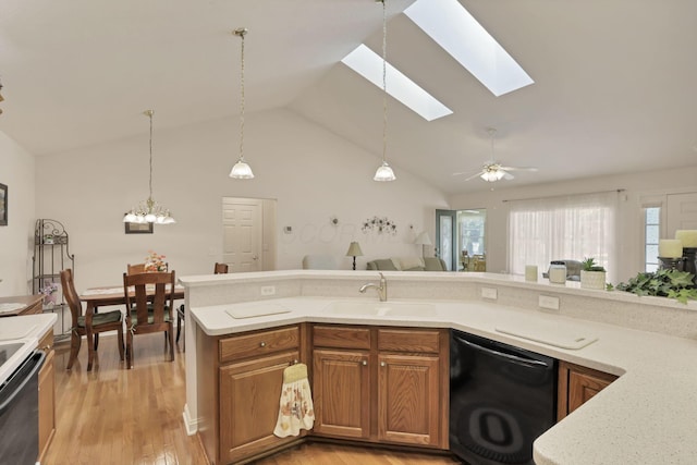 786 Stone Ridge Way, Newark, OH 43055 - kitchen with black dishwasher, range, a skylight, brown cabinetry, and vaulted ceiling