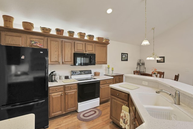 786 Stone Ridge Way, Newark, OH 43055 - kitchen with black appliances, light countertops, pendant lighting, light wood finished floors, and brown cabinets