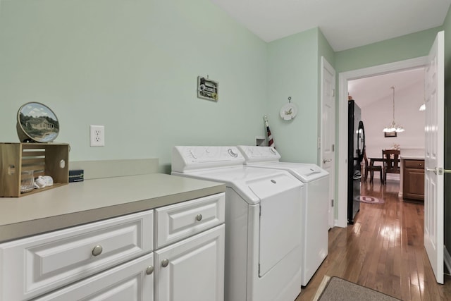786 Stone Ridge Way, Newark, OH 43055 - laundry area featuring cabinet space, washing machine and clothes dryer, a chandelier, and dark wood-style flooring