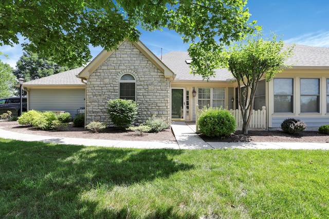 786 Stone Ridge Way, Newark, OH 43055 - view of front facade featuring stone siding, a front yard, and a shingled roof