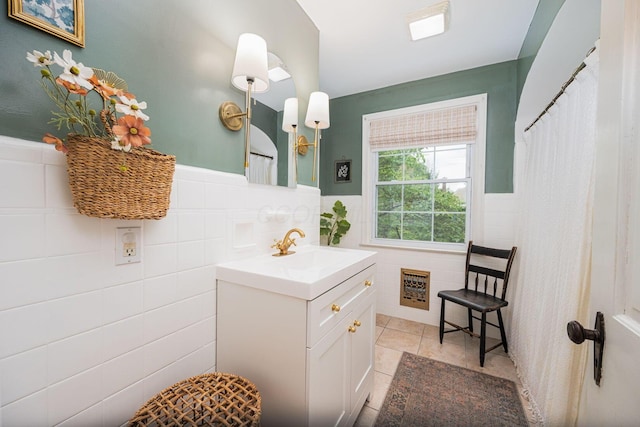922 S Remington Rd, Columbus, OH 43209 - full bath featuring tile walls, vanity, tile patterned floors, wainscoting, and a shower with shower curtain