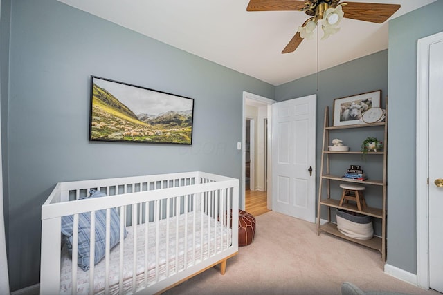 922 S Remington Rd, Columbus, OH 43209 - carpeted bedroom with a nursery area and a ceiling fan