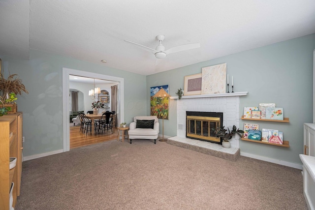 922 S Remington Rd, Columbus, OH 43209 - carpeted living room with a brick fireplace and ceiling fan