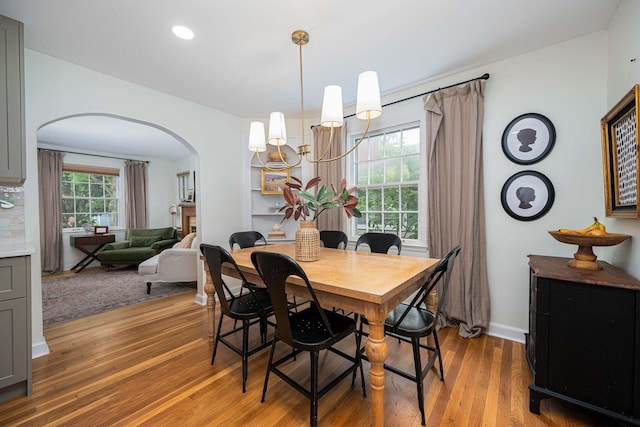 922 S Remington Rd, Columbus, OH 43209 - dining area with arched walkways, light wood finished floors, and recessed lighting