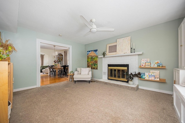 922 S Remington Rd, Columbus, OH 43209 - carpeted living area featuring ceiling fan and a brick fireplace
